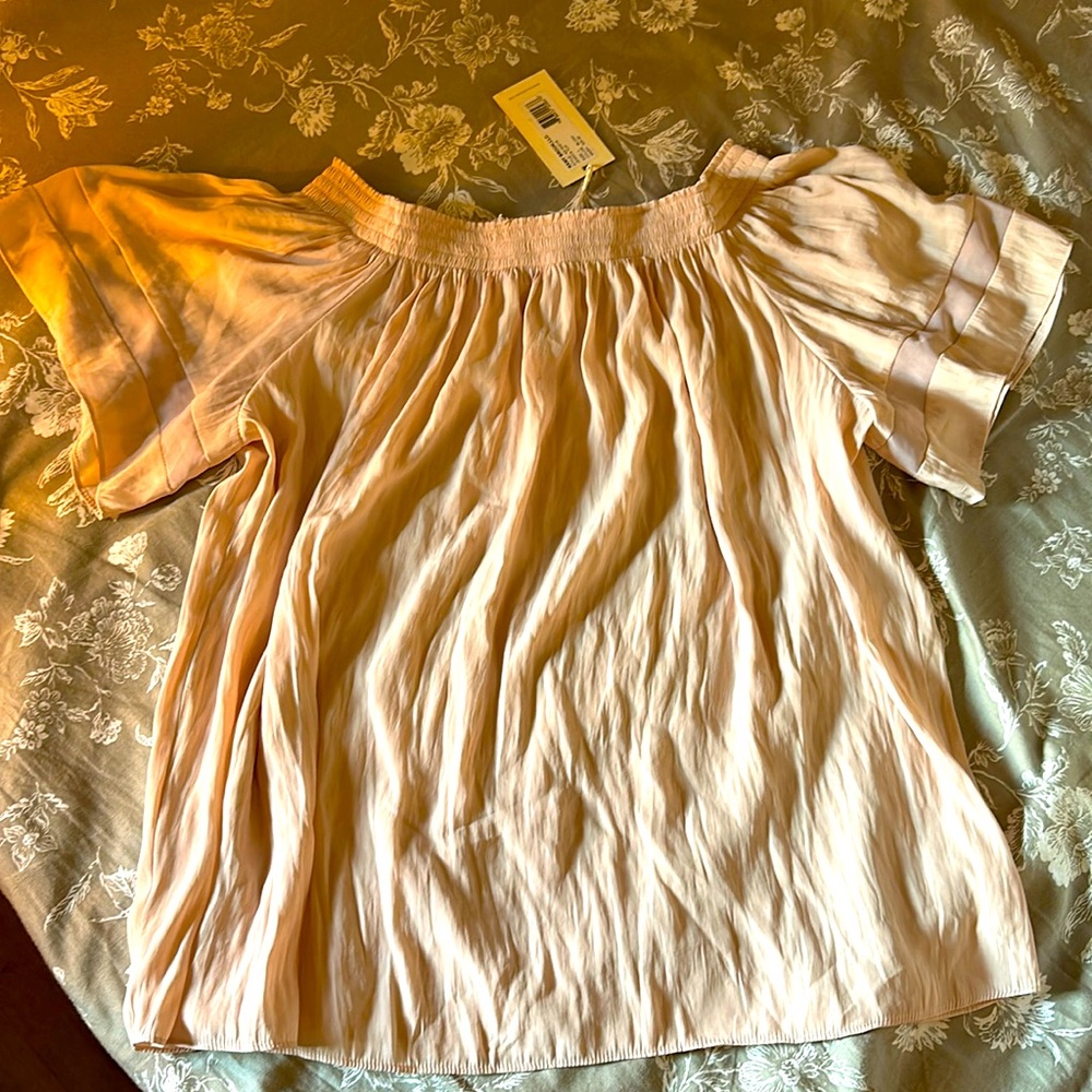 Off the shoulder silky blouse.